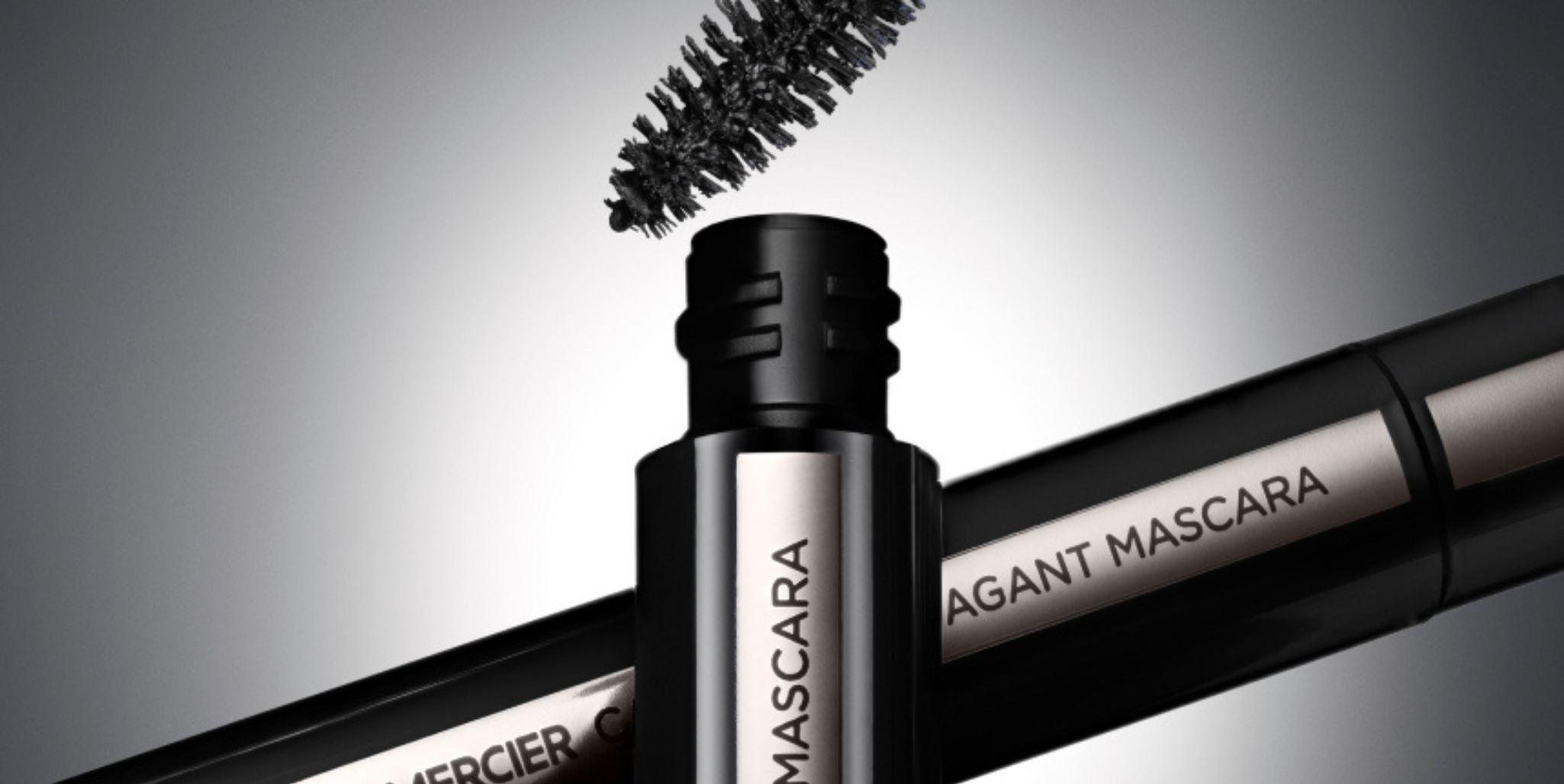 Close up visual of Caviar Extravagant Mascara on black and white gradient background